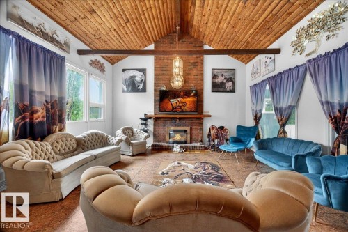 Vaulted wood-finish plank ceiling with exposed beams - 140 50047 Rge Rd 244, Rural Leduc County, AB 