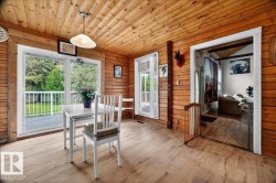 Wood-finish flooring throughout, complemented by a wood-plank ceiling and walls - 