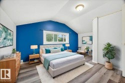 Vaulted ceiling bedroom featuring a vibrant accent wall, expansive window, wood-finish flooring, and a flush-mount ceiling light fixture - 