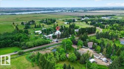 Expansive property featuring mature trees and lush green landscaping - 