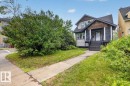 Craftsman-style exterior with stone veneer and cedar shake accents - 10958 88 Avenue, Edmonton, AB 