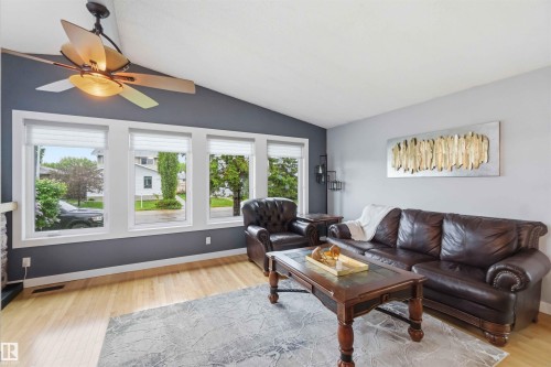 Living area with vaulted ceiling and wood-finish flooring - 11431 144 Avenue, Edmonton, AB 