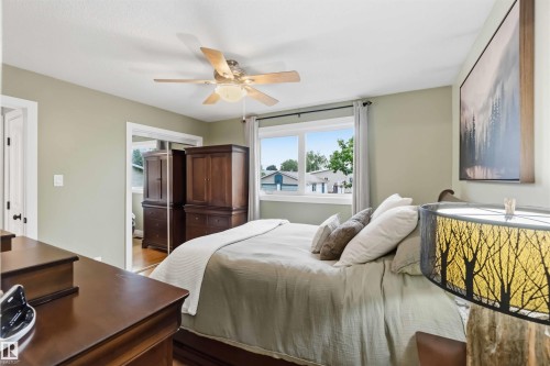 Recessed window with white trim, light-colored walls, and a ceiling fan with integrated lighting - 11431 144 Avenue, Edmonton, AB 