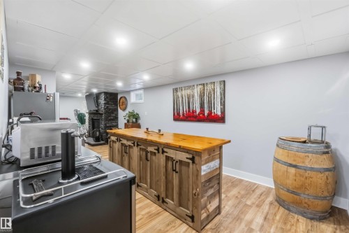 Reclaimed wood-finish bar with a solid wood countertop - 11431 144 Avenue, Edmonton, AB 