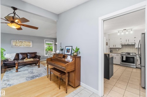 Open-concept living area with vaulted ceilings and wood-finish flooring - 11431 144 Avenue, Edmonton, AB 