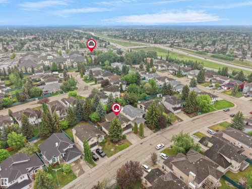 Aerial perspective of an established suburban residential area with mature trees and paved streets - 208 Ferguson Place, Edmonton, AB 