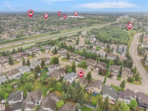 Aerial view showcasing a residential neighborhood with varied architectural styles and abundant mature trees - 208 Ferguson Place, Edmonton, AB 