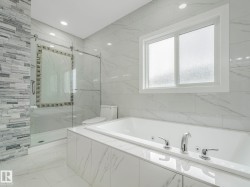 Soaking tub with integrated jets and polished chrome fixtures - 