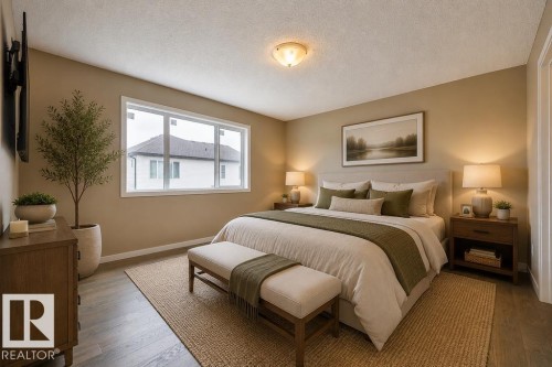 Bedroom featuring wood-finish flooring, a contemporary window, and a ceiling-mounted light fixture. Virtually Staged Photos - 2031 207 Street, Edmonton, AB 
