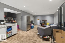 Lower level space featuring wood-finish flooring and recessed lighting - 