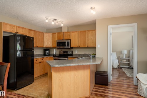 103 13710 150 Avenue, Edmonton, AB - Indoor Photo Showing Kitchen With Double Sink