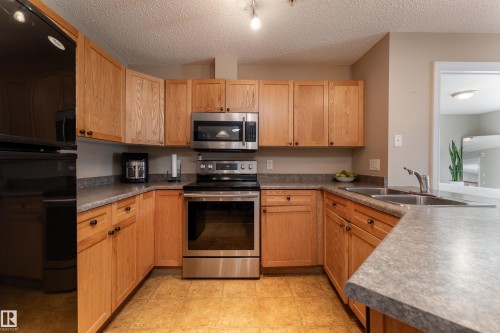 103 13710 150 Avenue, Edmonton, AB - Indoor Photo Showing Kitchen With Double Sink