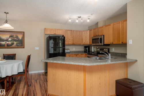 103 13710 150 Avenue, Edmonton, AB - Indoor Photo Showing Kitchen With Double Sink