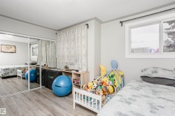 Room featuring wood-finish flooring and light gray walls - 