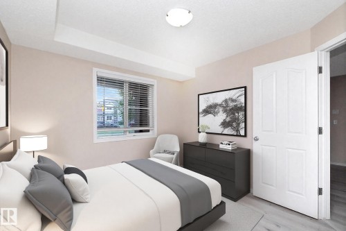 Bedroom with a single window featuring horizontal blinds and a white frame - 108 530 Watt Boulevard, Edmonton, AB 