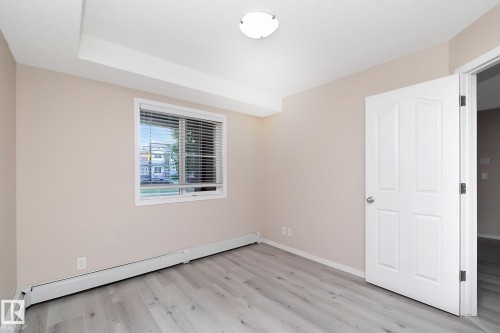 Room featuring light wood-finish flooring and neutral wall tones - 108 530 Watt Boulevard, Edmonton, AB 