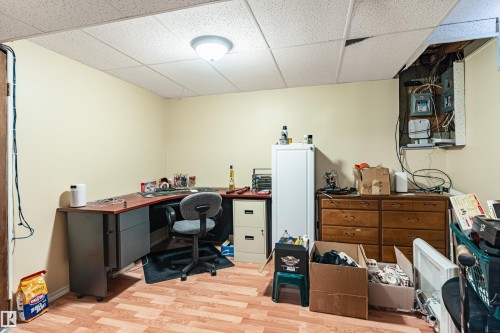 Versatile room with light-toned walls and wood-look flooring - 9011 60 Street, Edmonton, AB 