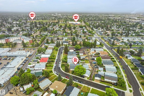 Aerial perspective of a residential neighborhood featuring established trees and a network of paved streets - 9011 60 Street, Edmonton, AB 