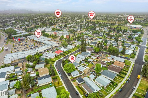 Aerial perspective showcasing a residential neighborhood with surrounding commercial establishments and green spaces - 9011 60 Street, Edmonton, AB 