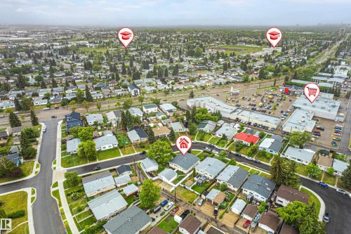 Aerial perspective of a residential neighborhood featuring established homes and mature trees - 9011 60 Street, Edmonton, AB 