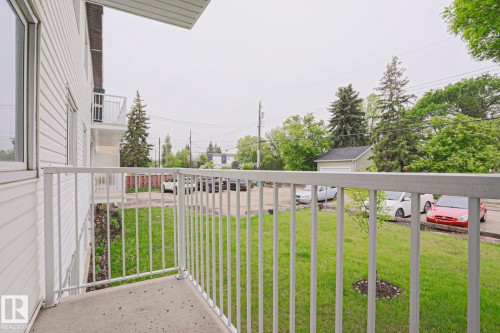 Private balcony with concrete flooring and white metal railings - 205 14903 92 Avenue Nw, Edmonton, AB 