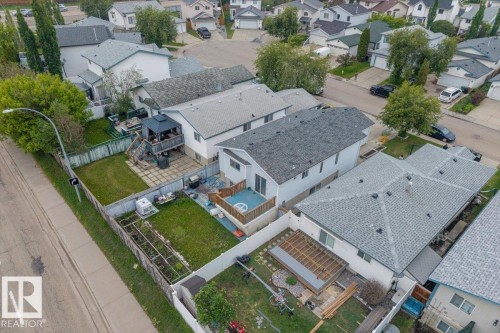 Residential property featuring an asphalt shingle roof - 8103 154 Avenue, Edmonton, AB 