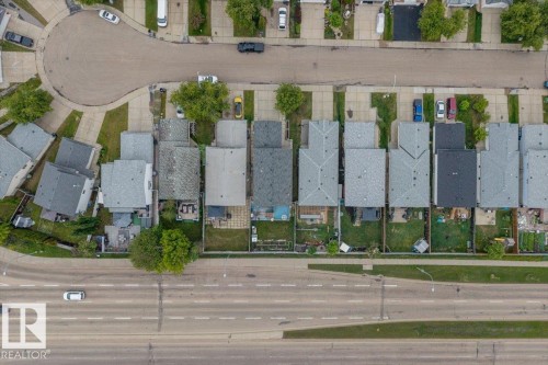 Aerial perspective showcasing a residential development with various roof styles including gabled and flat - 8103 154 Avenue, Edmonton, AB 