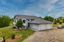 Split-level residence featuring light blue siding and a dark shingle roof - 14 53122 Rge Road 14, Rural Parkland County, AB 