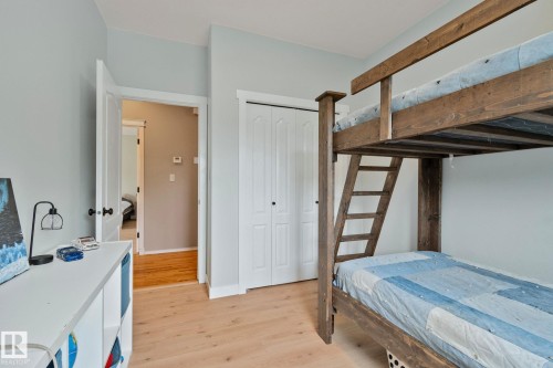Light wood-finish flooring complements the light blue wall paint - 14 53122 Rge Road 14, Rural Parkland County, AB 