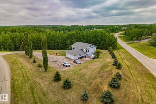 Light blue siding exterior with a grey shingle roof and an attached two-car garage - 14 53122 Rge Road 14, Rural Parkland County, AB 