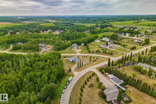Expansive aerial perspective showcasing a residential area with varied housing styles - 14 53122 Rge Road 14, Rural Parkland County, AB 