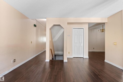 Warm-toned wall paint throughout with dark wood-finish flooring - 5 20 Deerbourne Drive, St. Albert, AB 