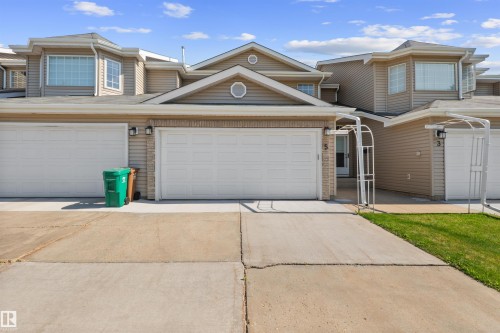 Multi-unit property with tan siding and white trim - 5 20 Deerbourne Drive, St. Albert, AB 