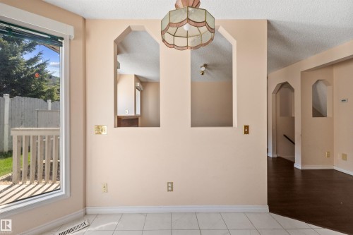 Bay window with a white frame and outdoor deck access - 5 20 Deerbourne Drive, St. Albert, AB 