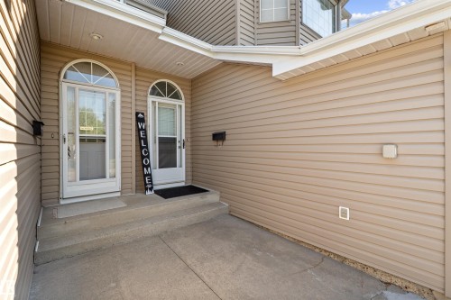 Entryway featuring twin white doors with arched transom windows - 5 20 Deerbourne Drive, St. Albert, AB 