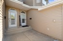 Entryway featuring twin white doors with arched transom windows - 5 20 Deerbourne Drive, St. Albert, AB 