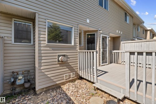 Private deck with composite decking and wooden railing - 5 20 Deerbourne Drive, St. Albert, AB 