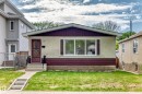 Single-story residence featuring a stucco exterior with a dark red accent band - 12022 62 Street, Edmonton, AB 