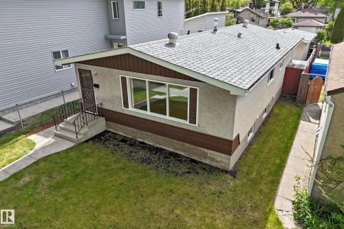 Single-story residence featuring a stucco exterior with brown trim accents - 12022 62 Street, Edmonton, AB 