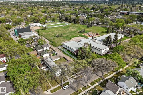 Aerial perspective showcasing an expansive residential area with abundant mature trees and varied architectural styles - 12022 62 Street, Edmonton, AB 