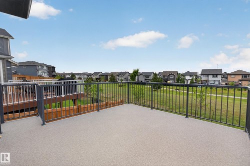 Spacious outdoor deck with textured surfacing and dark metal railings - 17023 45 Street, Edmonton, AB 