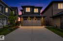 Modern two-story residence featuring a two-car garage with a concrete driveway - 17023 45 Street, Edmonton, AB 