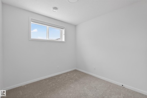 Room with neutral wall paint and carpeting - 17023 45 Street, Edmonton, AB 