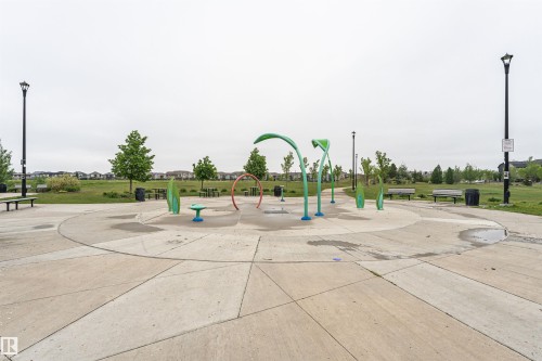 Concrete splash pad featuring various colorful water play structures - 8744 223 Street Nw, Edmonton, AB 