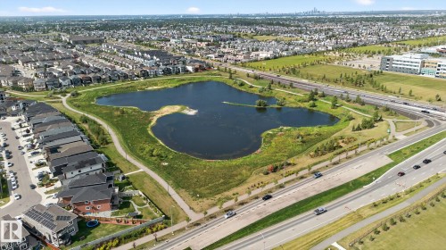 Aerial view showcasing a residential area with a prominent natural water feature - 1213 16A Street, Edmonton, AB 