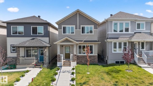 Modern two-story residence with a multi-textured facade featuring horizontal siding and stone accents - 1213 16A Street, Edmonton, AB 