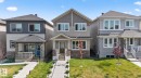 Modern two-story residence with a multi-textured facade featuring horizontal siding and stone accents - 1213 16A Street, Edmonton, AB 