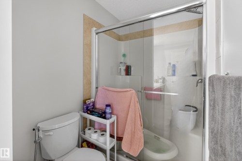 Shower enclosure with sliding glass door and chrome frame - 1404 25 Avenue, Edmonton, AB 