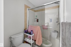 Shower enclosure with sliding glass door and chrome frame - 