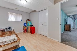 Light wood-finish flooring complements neutral wall tones - 